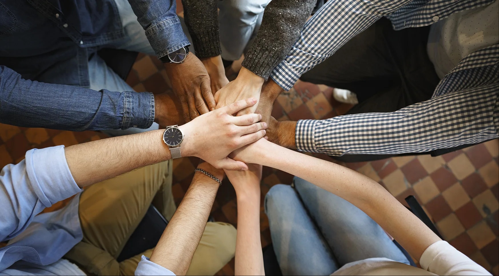Hands together in a team huddle