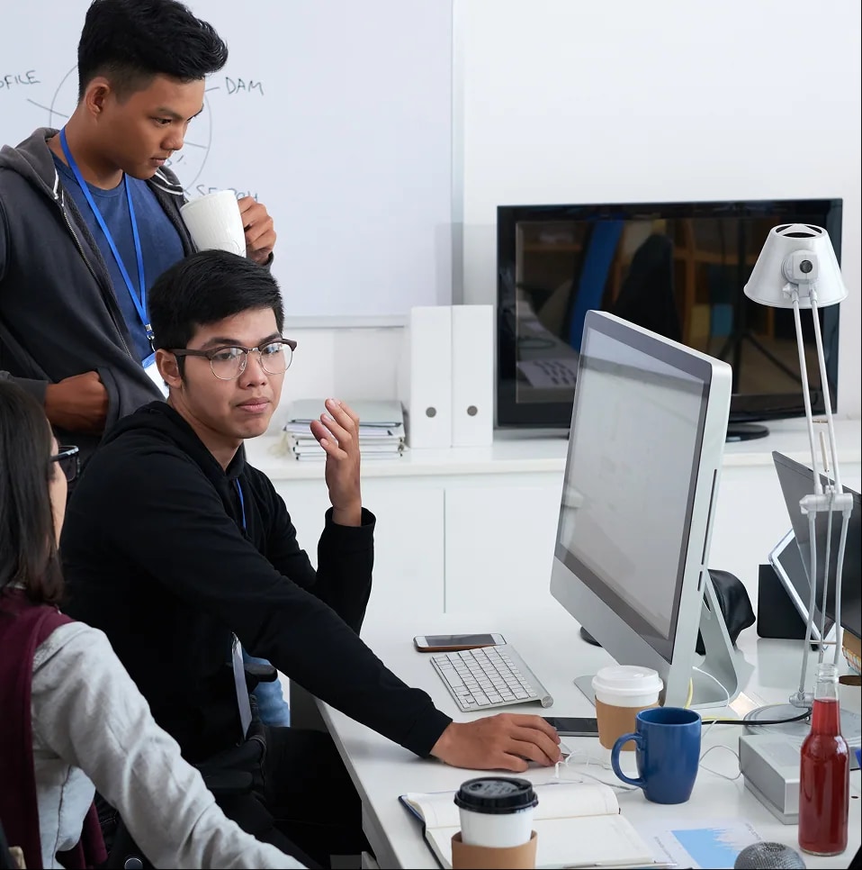 Colleagues collaborating at a computer